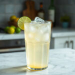 A finished Dirty Lime Soda, showcasing vibrant green lime and soda served in a glass.