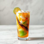 A finished glass of dirty soda topped with whipped cream and a cherry, showcasing this viral drink trend.
