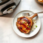 Finished slow cooker hawaiian pork chops plated and ready to serve.